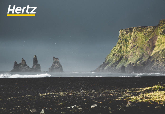 Hire a car and drive to the Reynisfjara black sand beach of Iceland