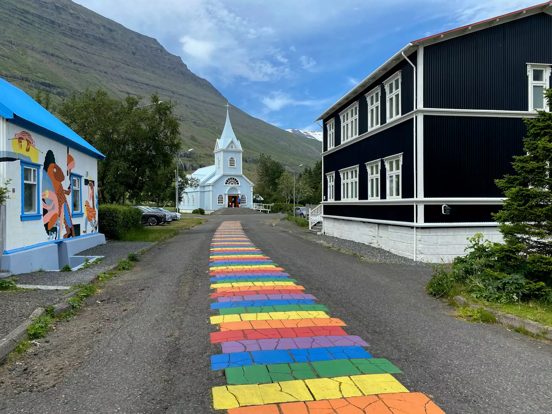 The iconic blue church and rainbow street in Seyðisfjörður East Iceland