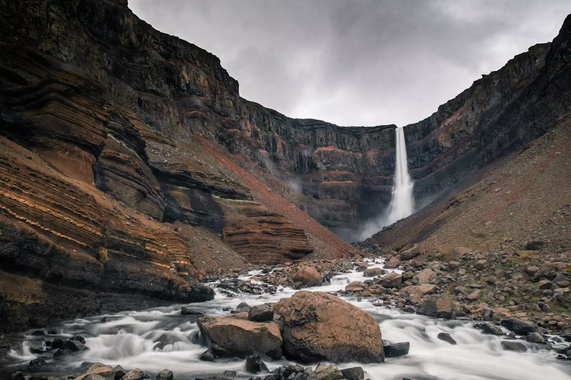 Hengifoss Waterfall with dramatic red clay stripes East Iceland