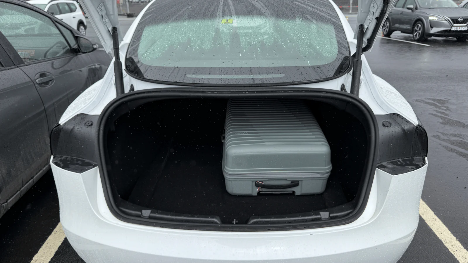 Tesla Model 3 trunk with 28 inch suitcase Iceland rental