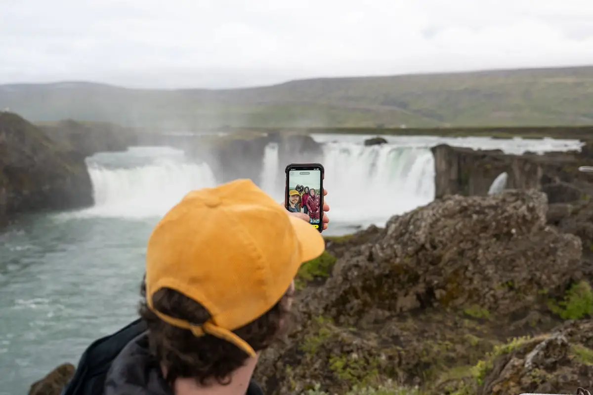 Traveler at Goðafoss waterfall in North Iceland